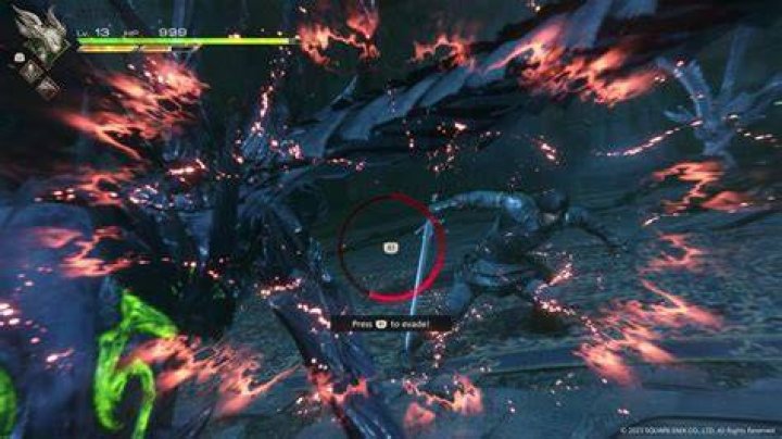 Clive Rosfield dodges an attack from an enemy in a dark chapel in a screenshot from Final Fantasy 16