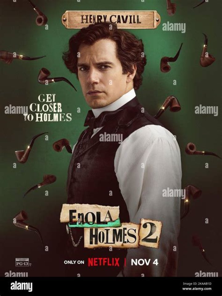 Henry Cavill as Sherlock Holmes, Millie Bobby Brown as Enola Holmes, Louis Partridge as Tewkesbury in Enola Holmes 2. Enola holds up a piece of paper and points at it while the others look on.