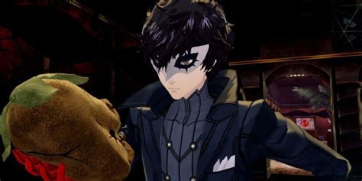 Joker finds a Will Seed in a Persona 5 Royal dungeon, which looks like a glowing face on a long, red root.
