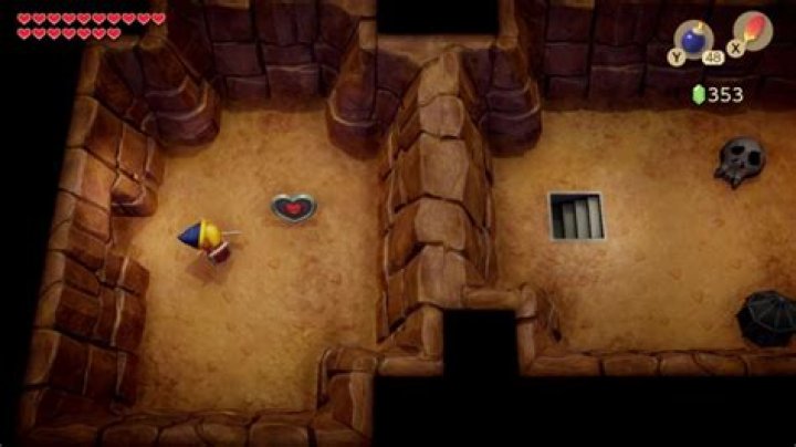 Link&rsquo;s Awakening using Hookshot to pull down a bridge in Catfish&rsquo;s Maw