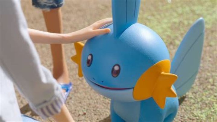 Mudkip getting a good pat on the head.